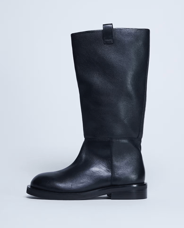 Black calf-length boots are trending.