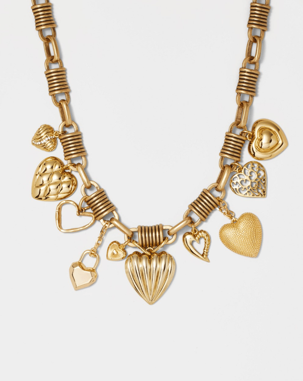 Gold charm necklace by accessories brand Mimco