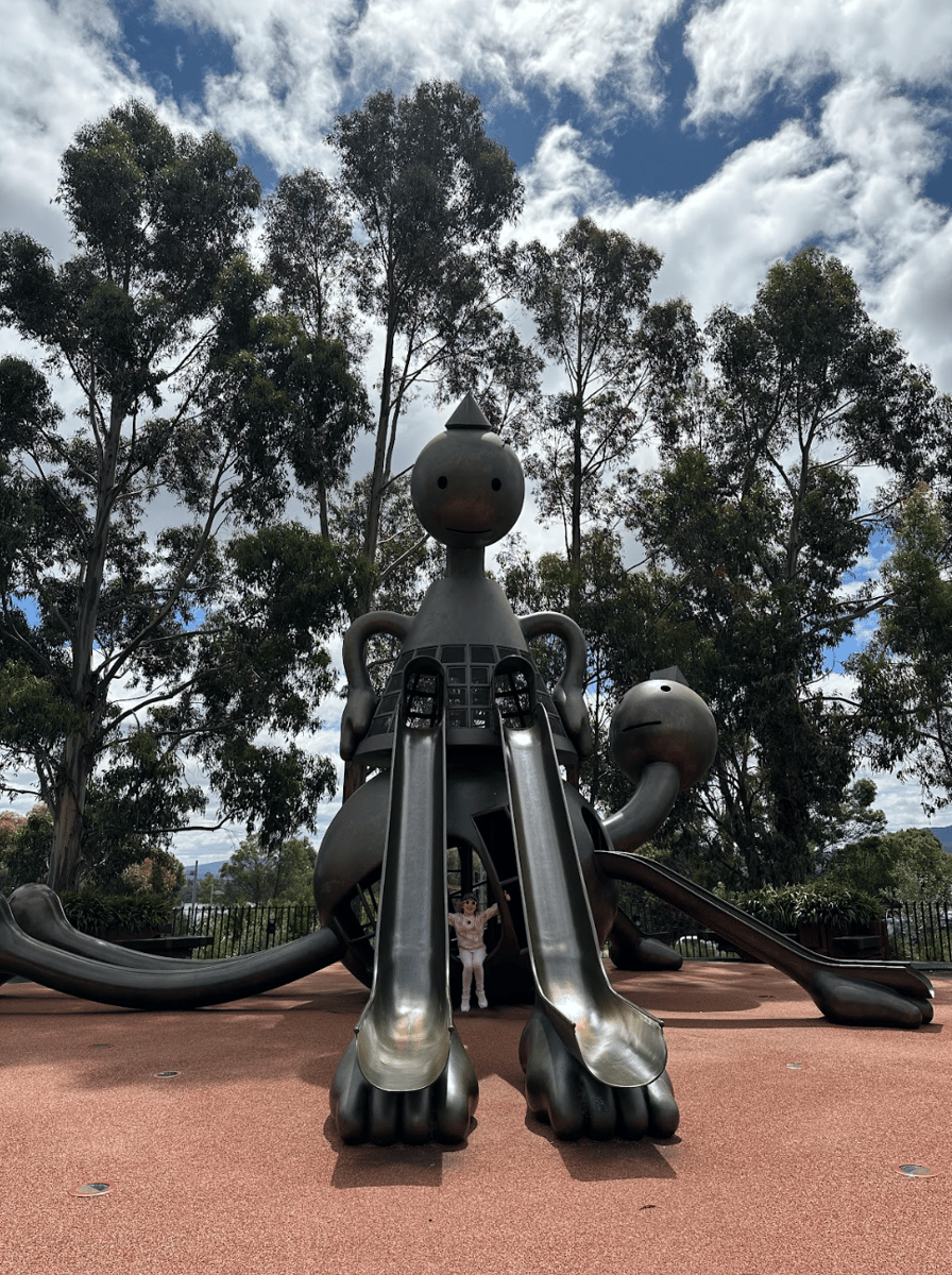 A girl visiting Girls Rule by Tom Otterness at the Museum of Old and New Art (MONA) in Hobart.