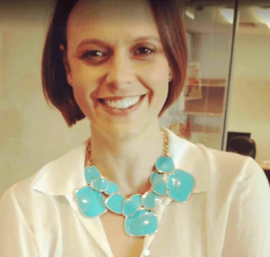 Mia Freedman wearing a gold and turquoise statement necklace.