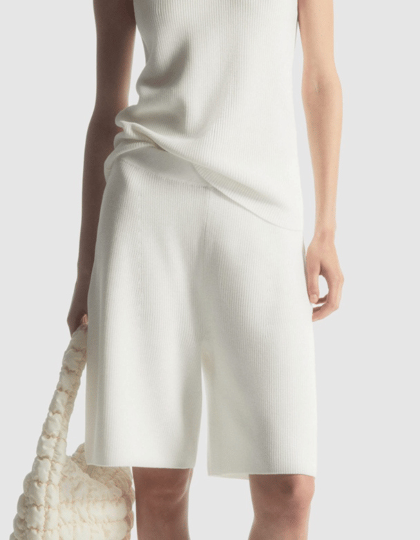 white ribbed knit bermuda shorts, white ribbed knit top, white puffy bag