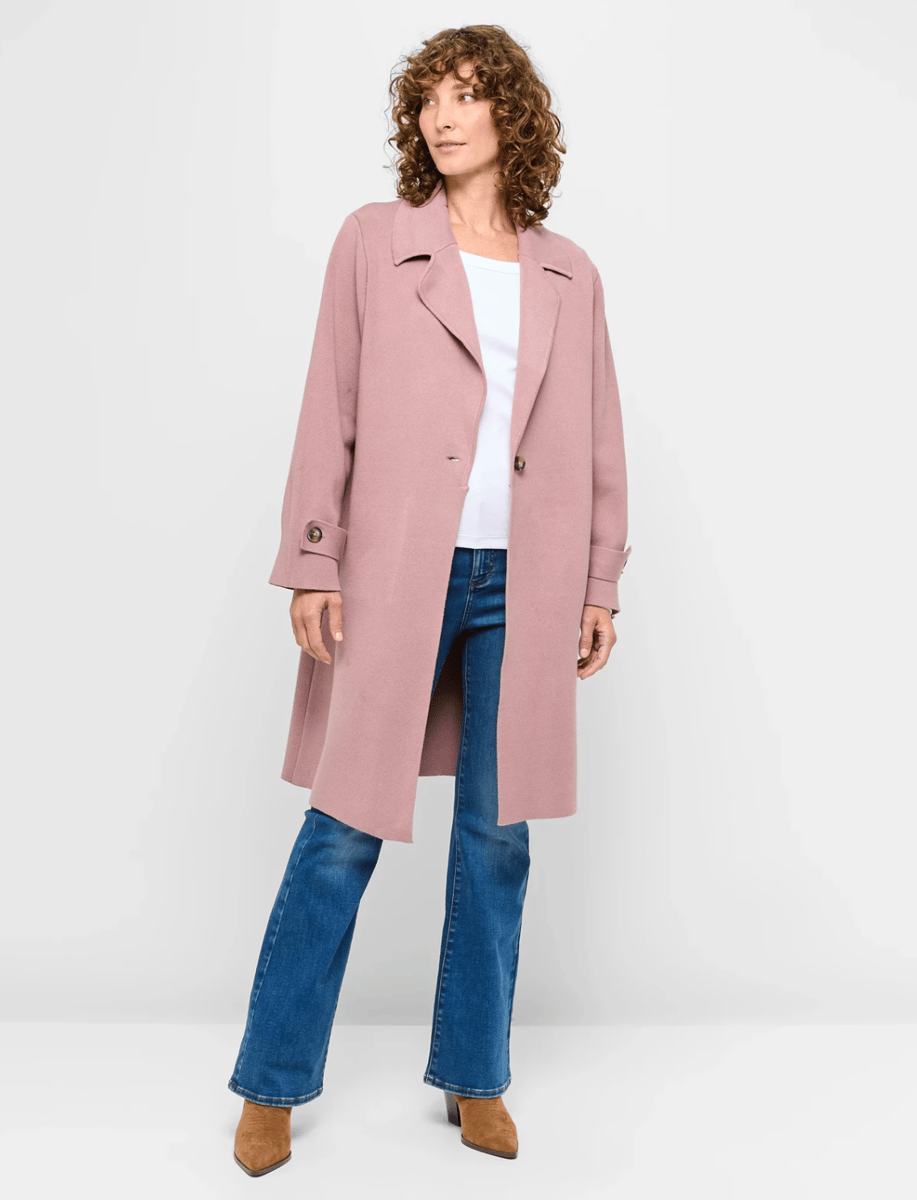 woman wearing turkish rose trench jacket from Target