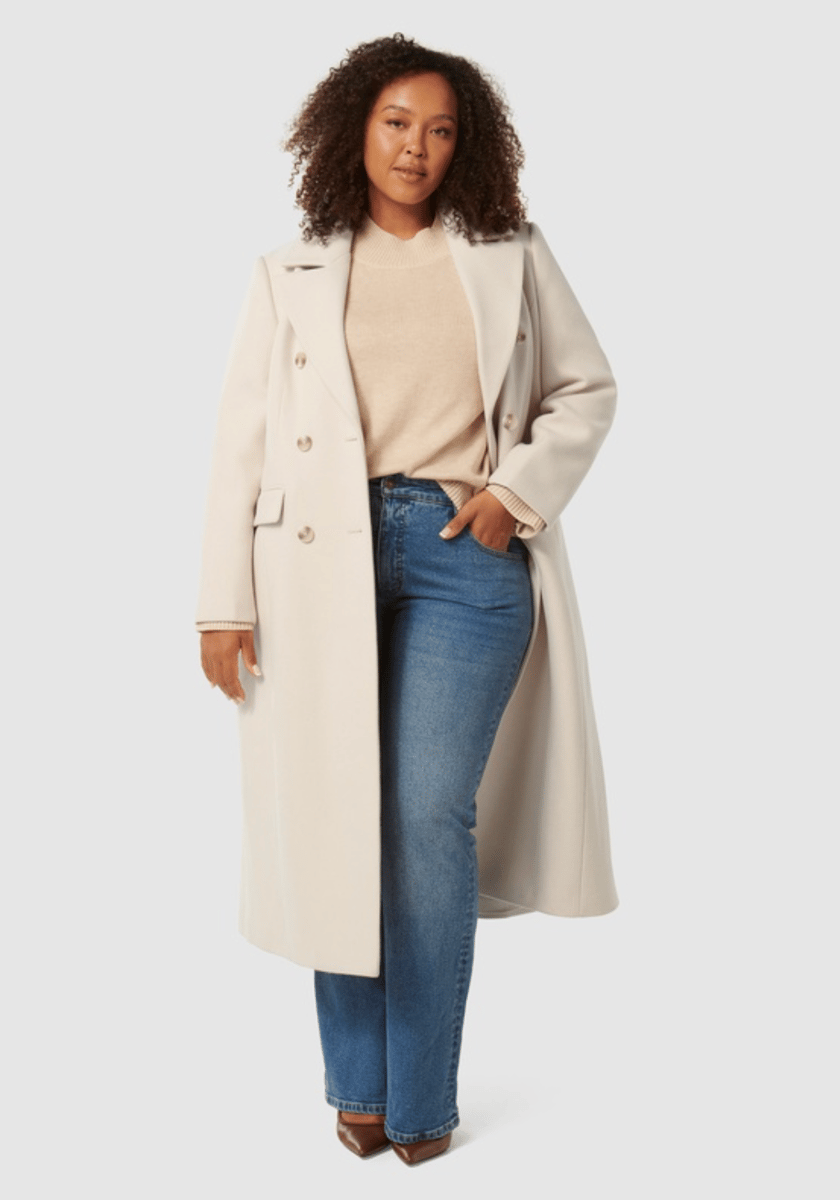 woman wearing cream maxi coat from Forever New Curve