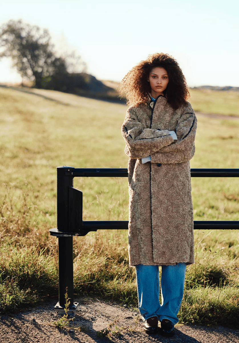 woman wearing coat in beige from H&M