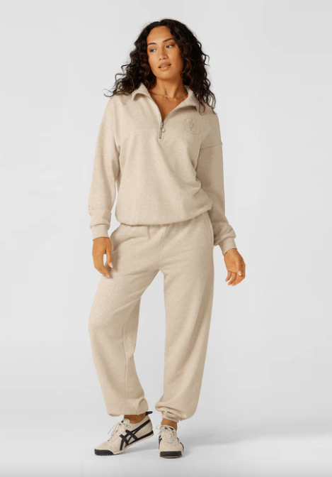 woman wearing 1/4 zip top and sweatpants from Lorna Jane