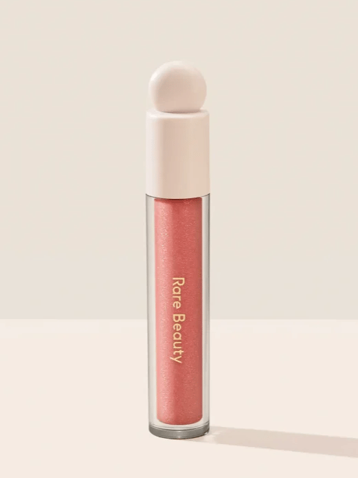 Rare Beauty Positive Light Luminizing Lip Gloss in Beam.
