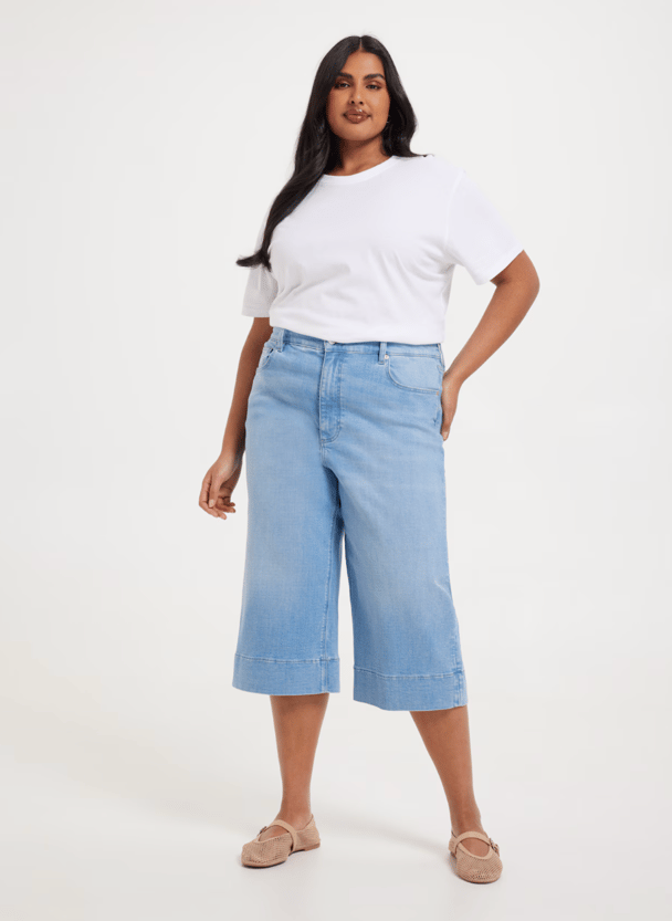 woman wearing high-rise wide leg capri in light blue