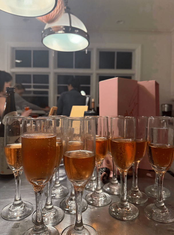 A collection of glasses filled with wine.