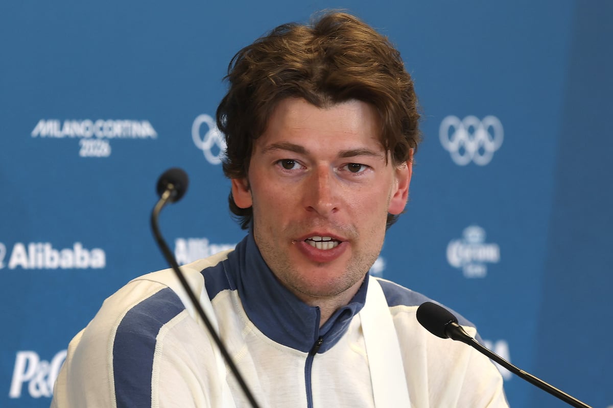 Sturla Holm Lægreid speaks at a press conference at the Winter Olympics on Feb 10 2026.