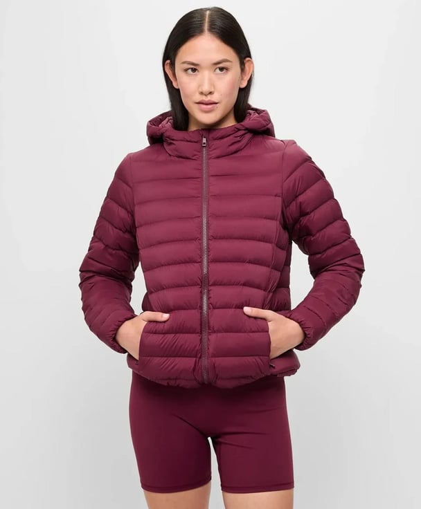 woman wearing mulberry puffer vest from Target