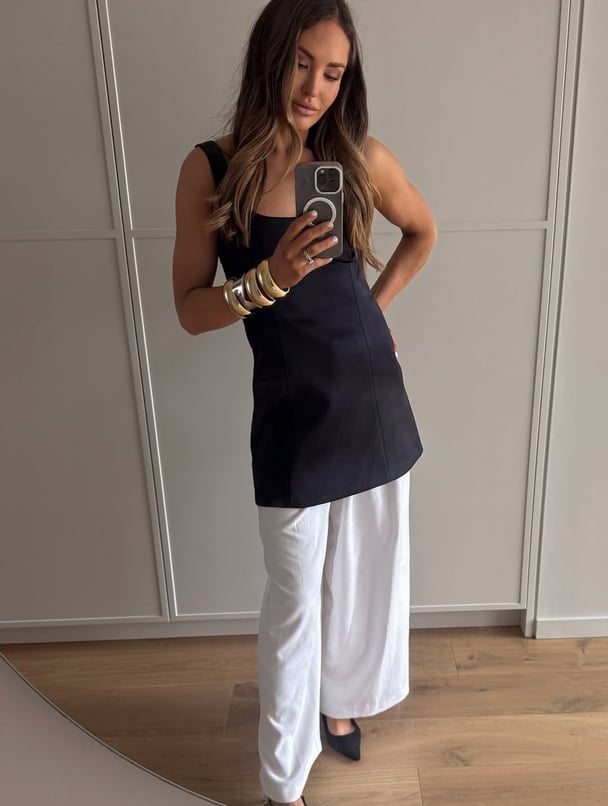 An expert guide to styling dresses over pants.