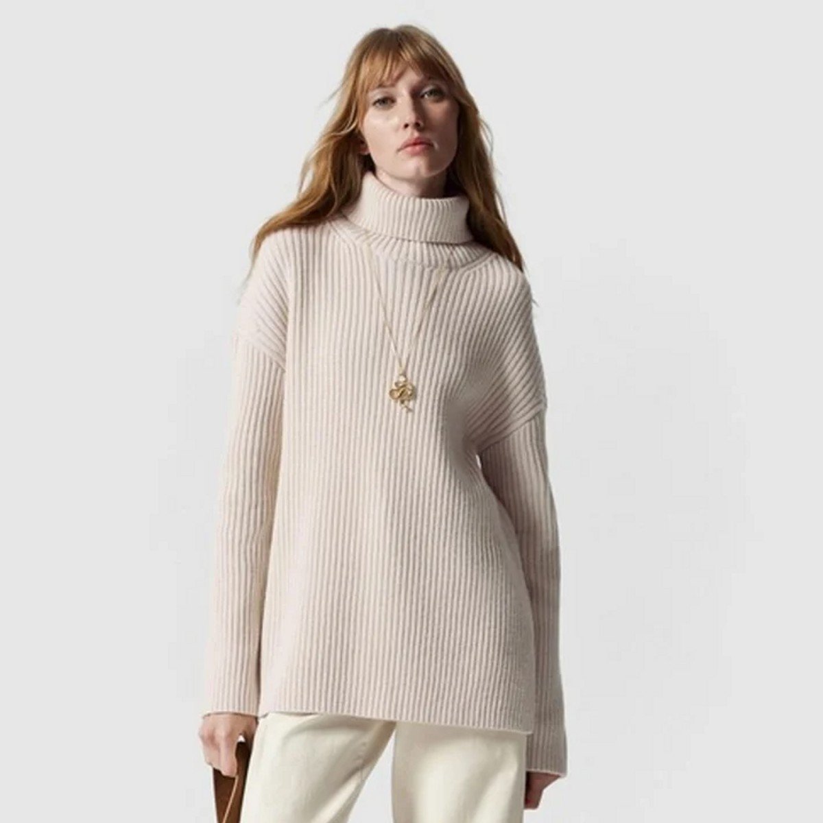 woman wearing light brown knit jumper from & Other Stories