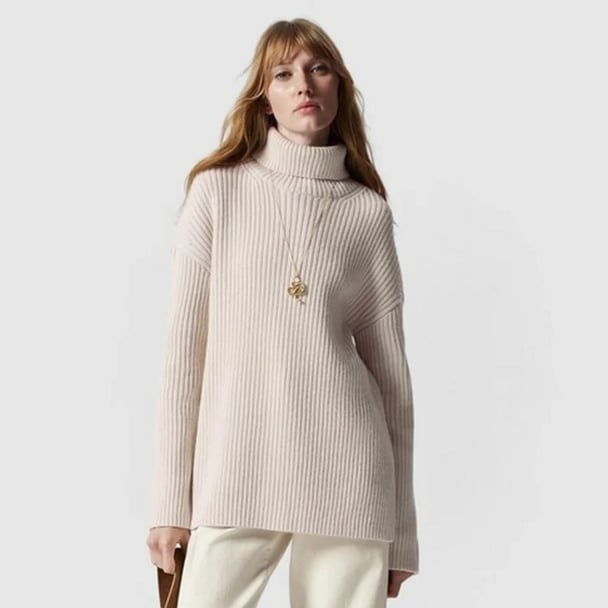 woman wearing light brown knit jumper from & Other Stories