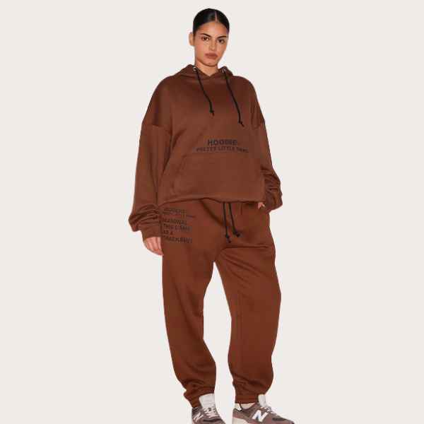 woman wearing hoodie and trackpants in brown from Pretty Little Thing