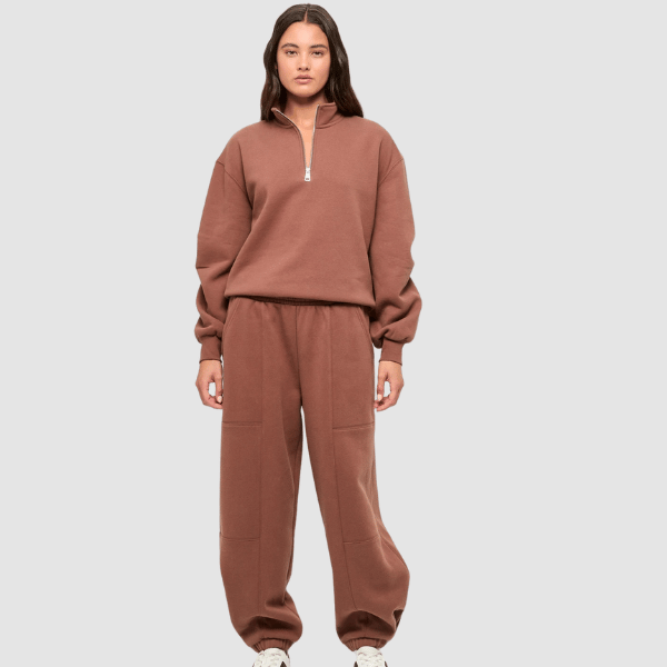 woman wearing 1/4 zip top and trackpants from Target