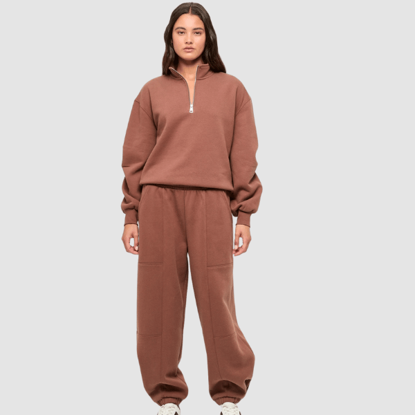 woman wearing 1/4 zip top and trackpants from Target