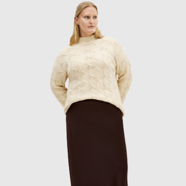woman wearing cream knit jumper from city chic