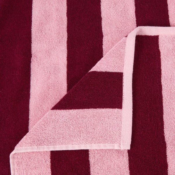 Cotton bath towel in pink and red stripes.