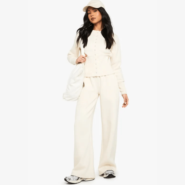 woman wearing tracksuit in cream from boohoo