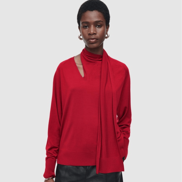 woman wearing jumper with an integrated scarf neckline from COS