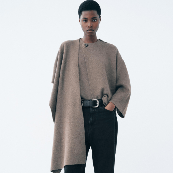 woman wearing knitted coat with scarf collar and long sleeves from Zara