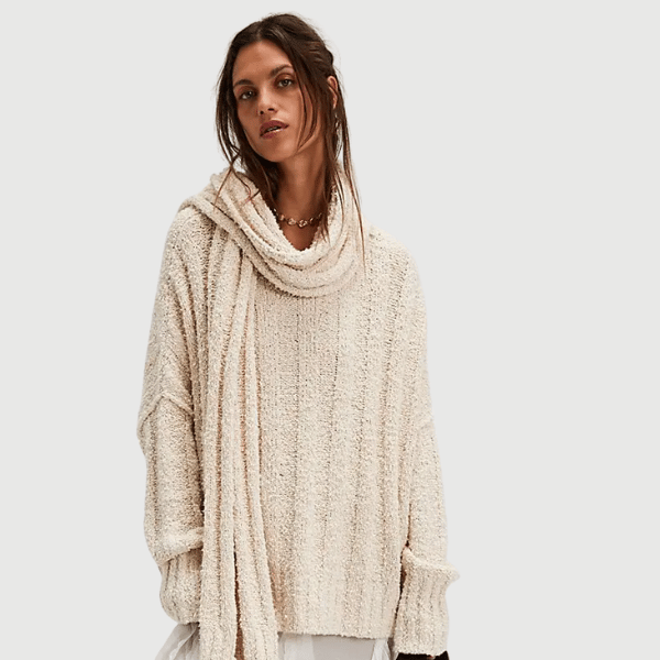 woman wearing oversized fit sweater with attached scarf from Free People
