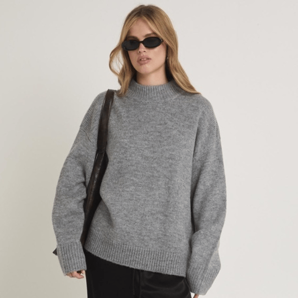 woman wearing grey knit jumper from Subtitled