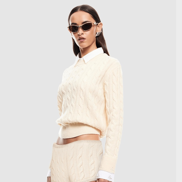 woman wearing cream knit jumper from Lioness