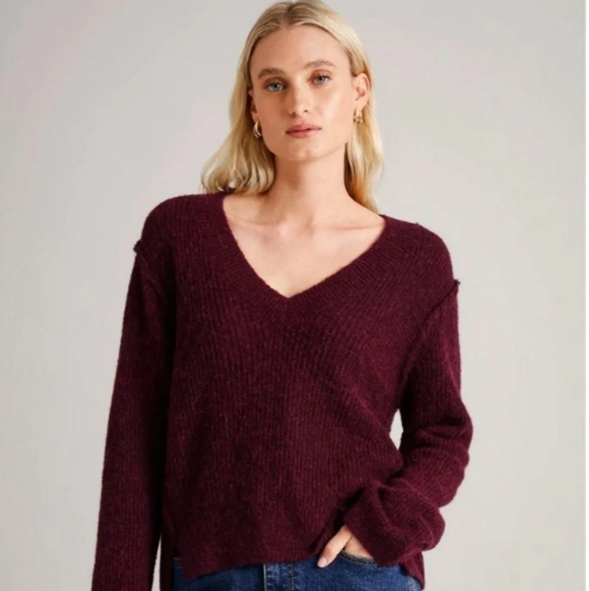woman wearing v neck knit jumper from Basque