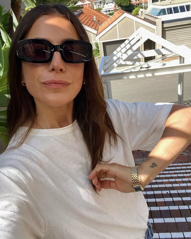 Writer wears a plain white t-shirt from Thrills.