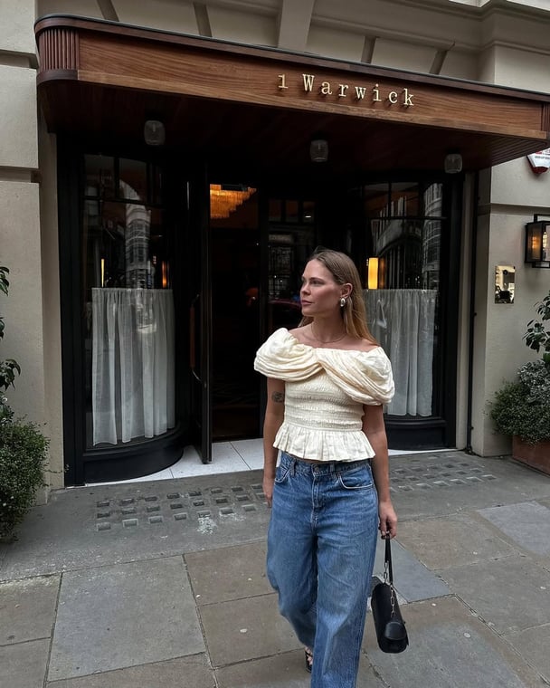 A dressy top with baggy jeans outfit.