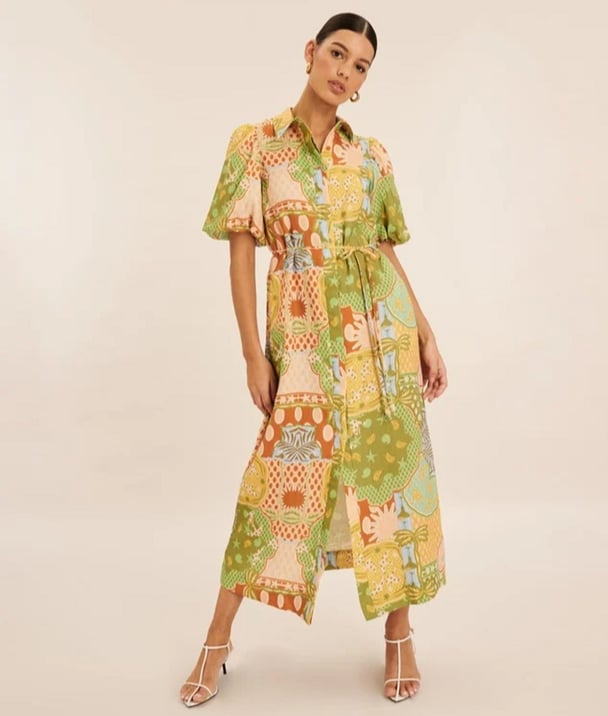 woman wearing long linen dress in hues of green yellow and orange AERE Linen Puff Sleeve Relaxed Shirt Dress