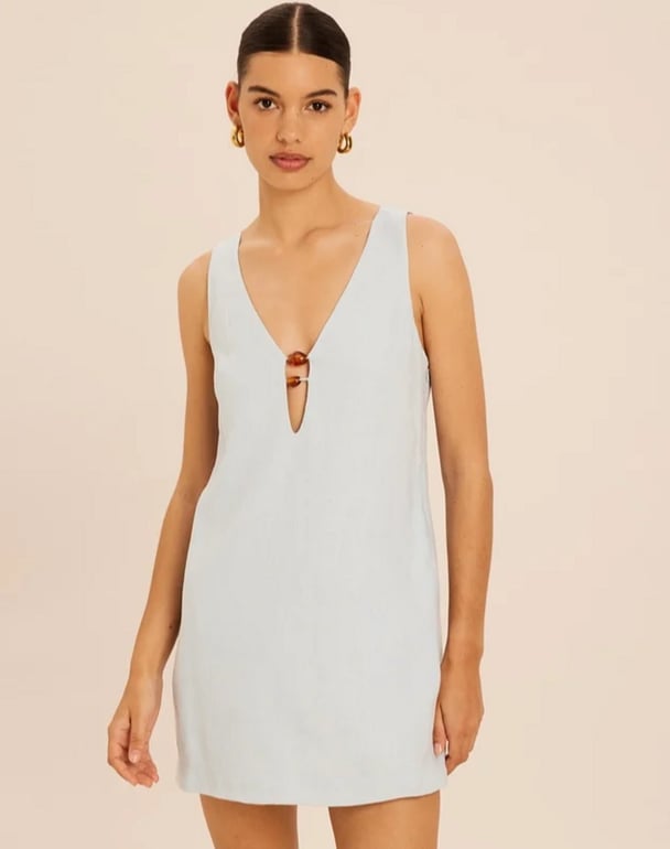 woman wearing linen shift dress with wooden beads Aere Linen Resin Trim Shift Dress