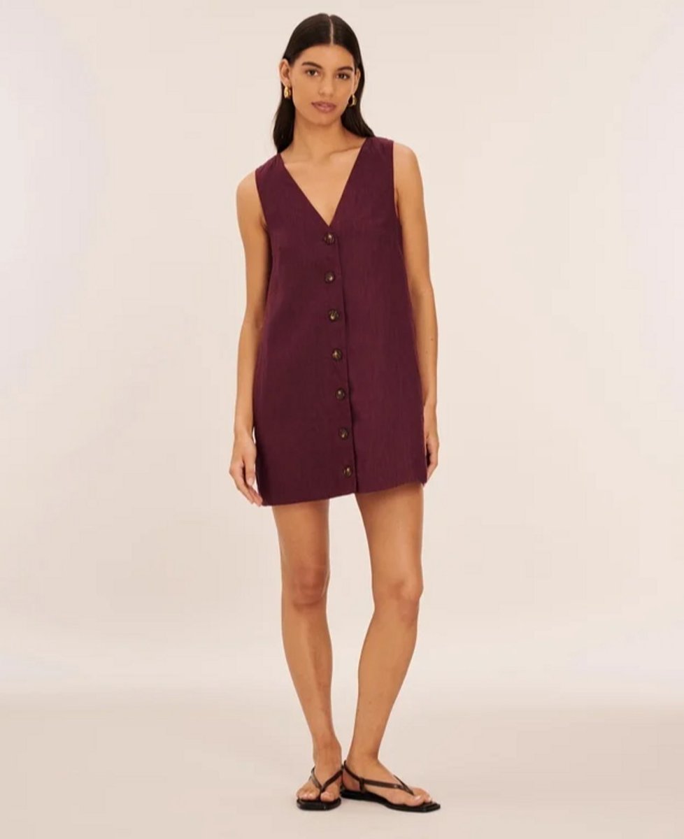 woman wearing plum mini dress