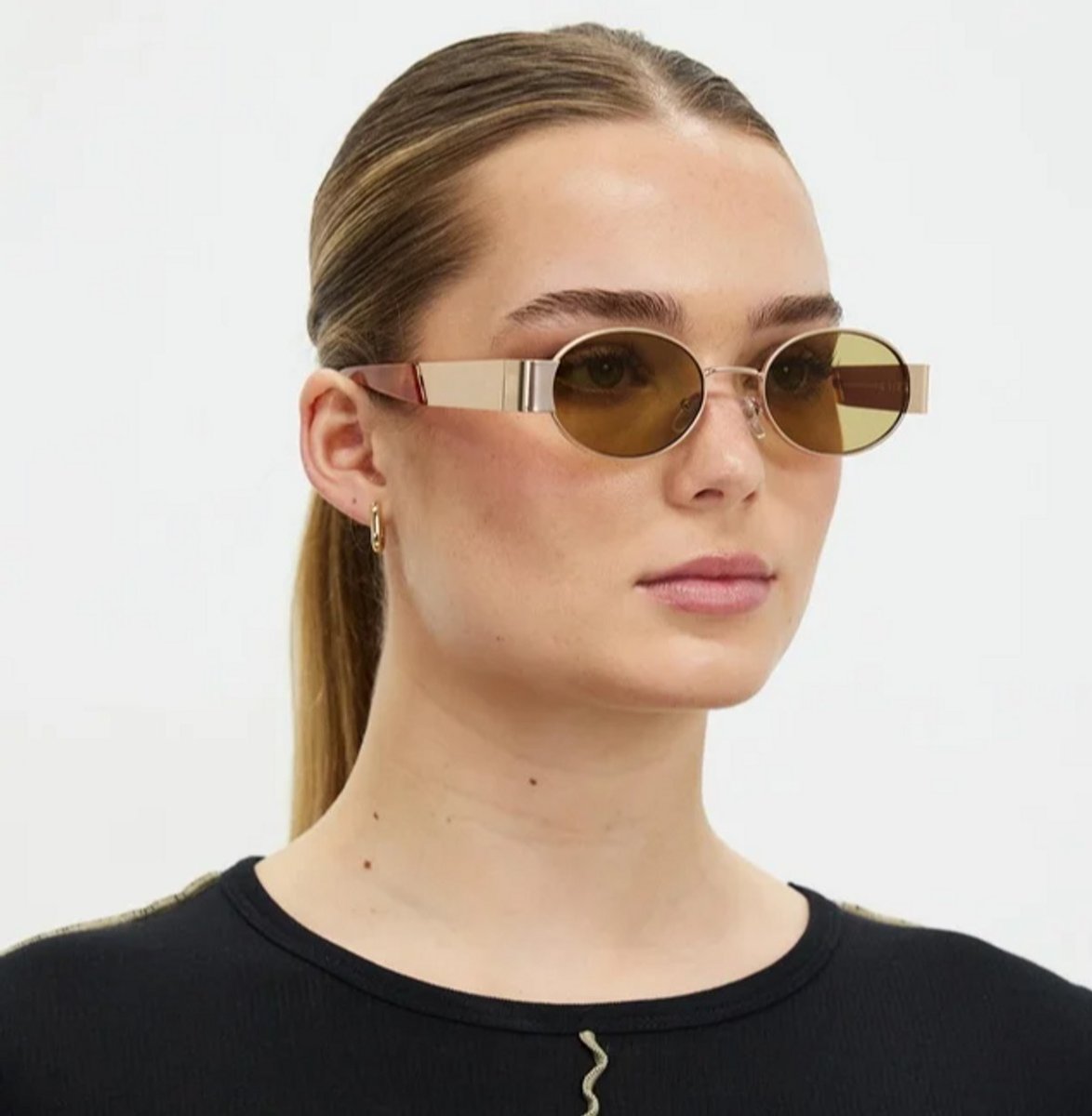 woman wearing gold aire sunglasses