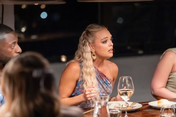 Alissa chatting at the dinner table.