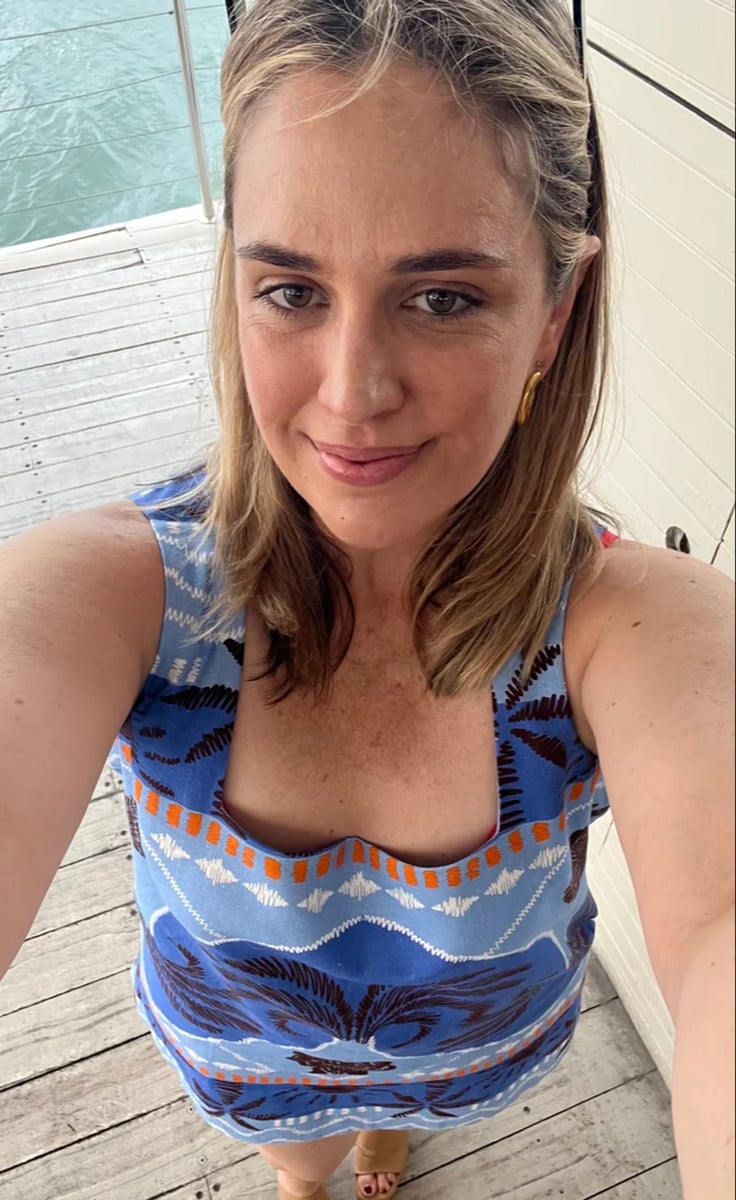 woman wearing blue dress selfie 