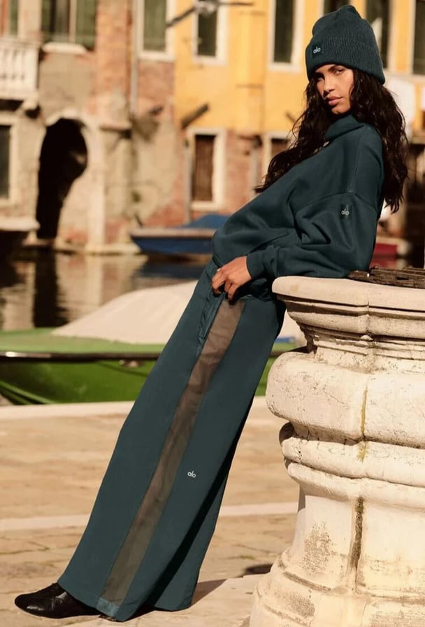 woman wearing green track suit set
