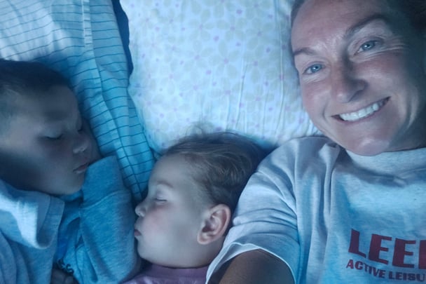 Amy and her children sleeping inside the tent.