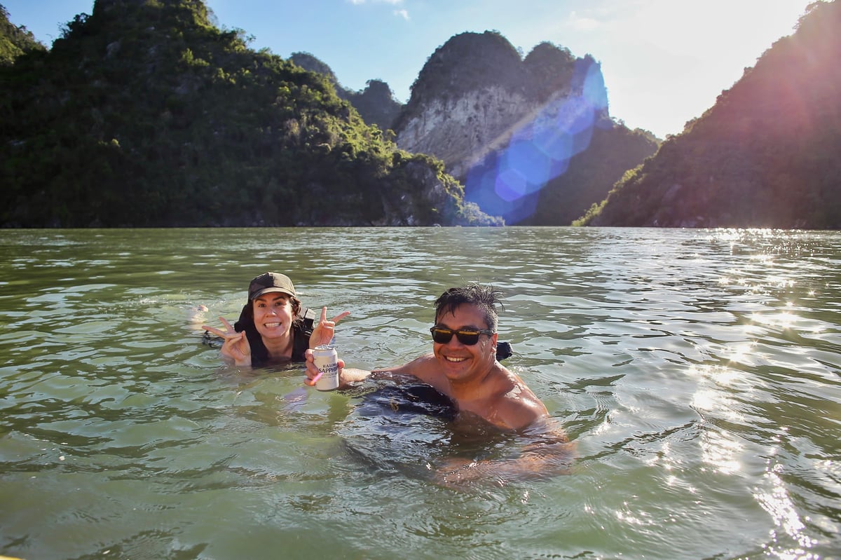 Ashlee and her boyfriend swimming while on holiday.