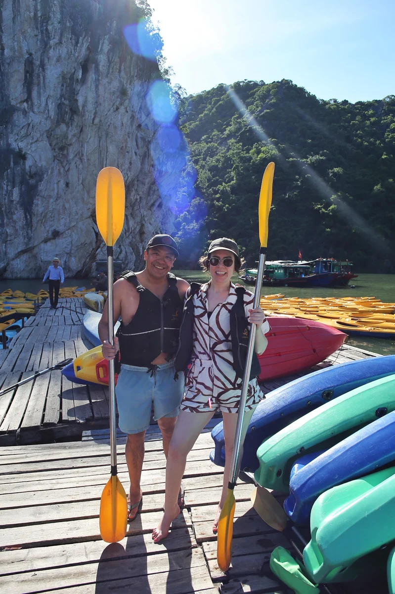 Ashlee and her partner hold kayak padels on holiday.