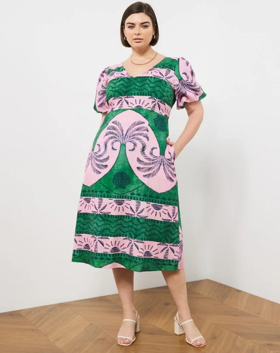 woman wearing midi dress in pink and green 