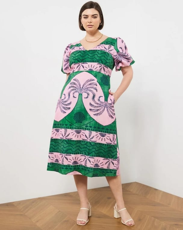 woman wearing midi dress in pink and green