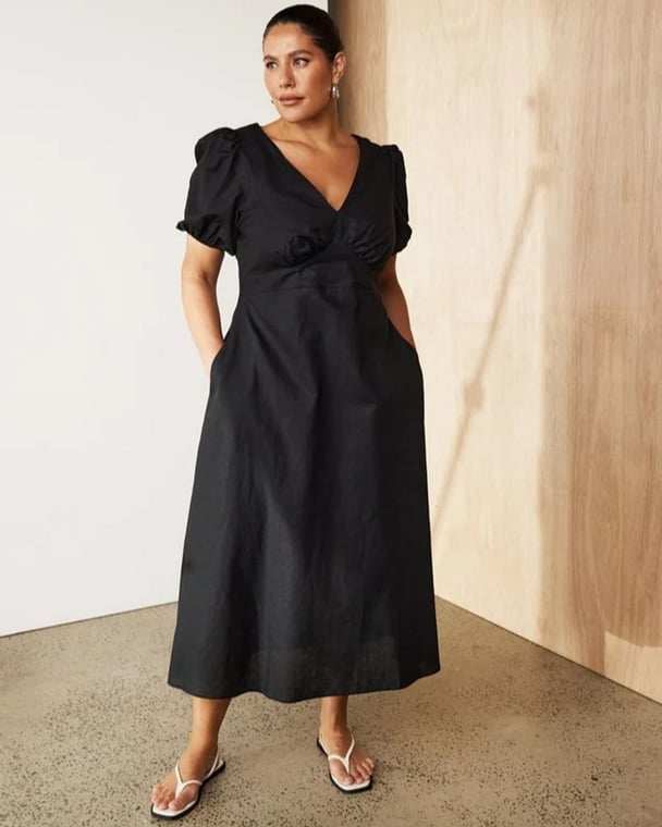 woman wearing black midi dress