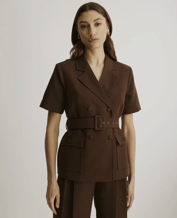 woman wearing chocolate short sleeve blazer