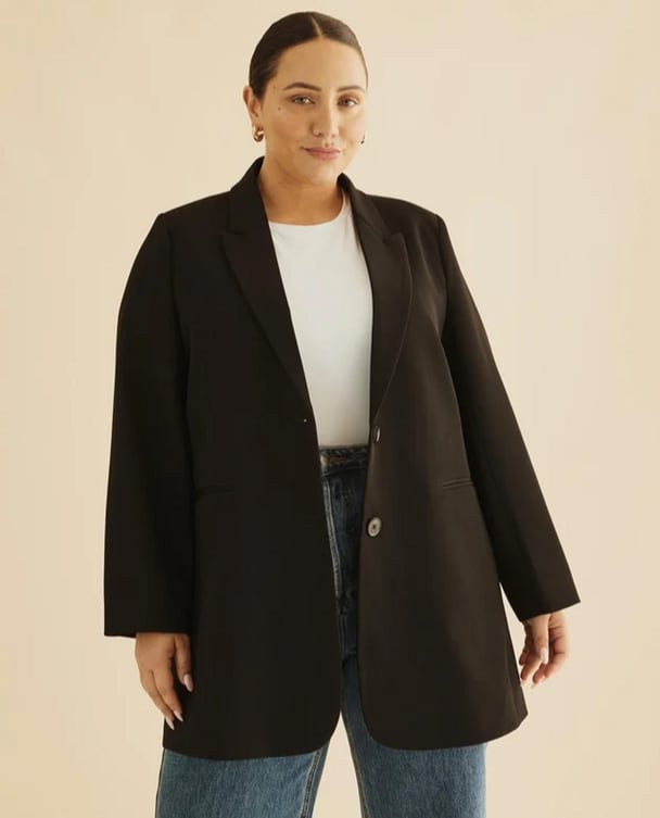 woman wearing over sized black blazer 