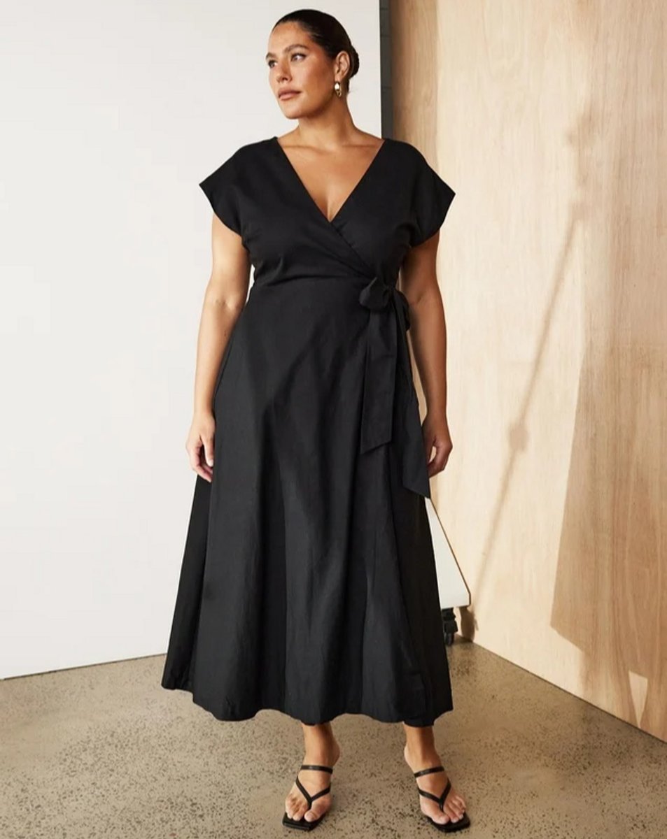 woman wearing wrap dress black