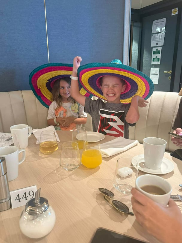 The kids wearing silly hats on board Carnival Cruises. Image: Supplied.