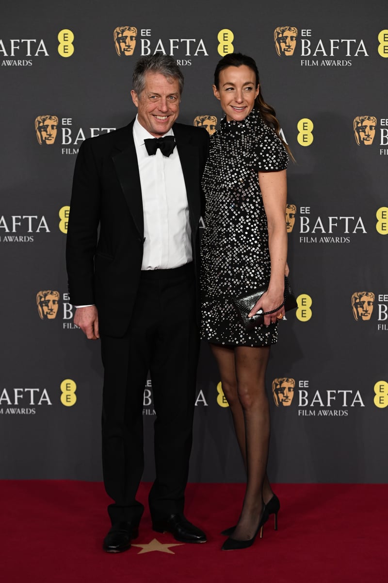 Hugh Grant and Anna Eberstein attend the 2025 EE BAFTA Film Awards at The Royal Festival Hall on February 16, 2025 in London.