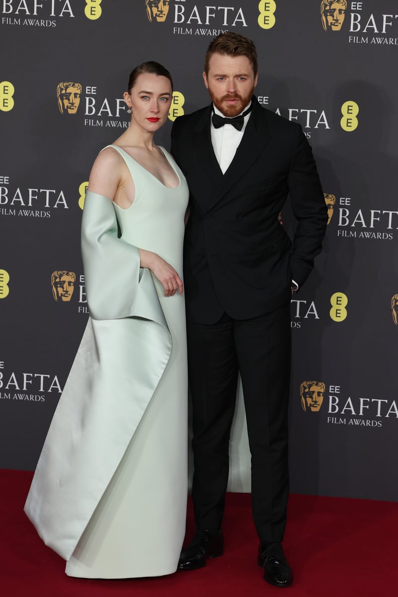 Saoirse Ronan and Jack Lowden attend the 2025 EE BAFTA Film Awards at The Royal Festival Hall on February 16, 2025 in London.